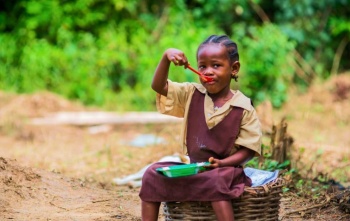 School child eating a Marys Meal
