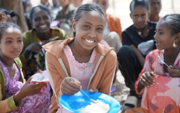 Nebyat enjoying her school meal