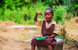 School child eating a Marys Meal
