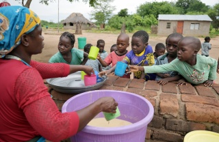 Children receiving meals in Zambia