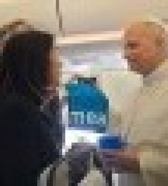 Pope Leo receiving a Marys Meals mug