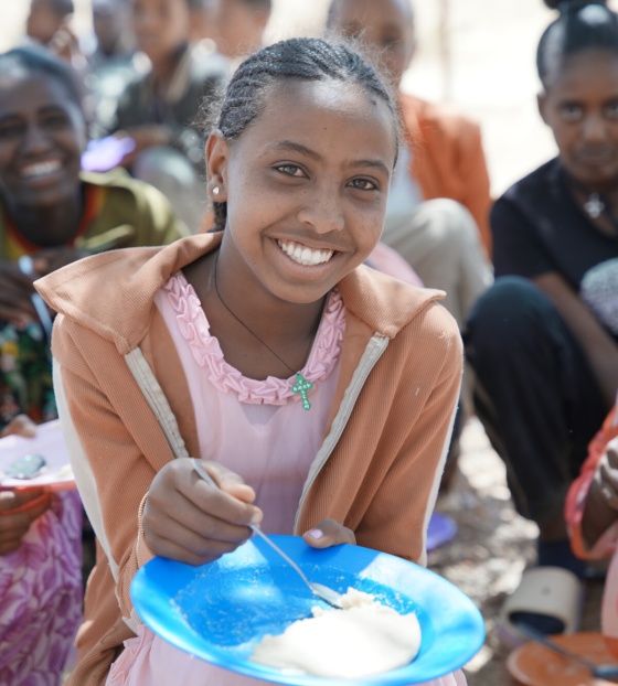 Nebyat enjoying her school meal