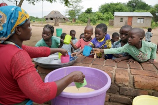 Children receiving meals in Zambia