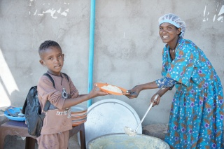 Meareg receiving porridge