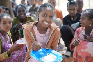 Nebyat enjoying her school meal